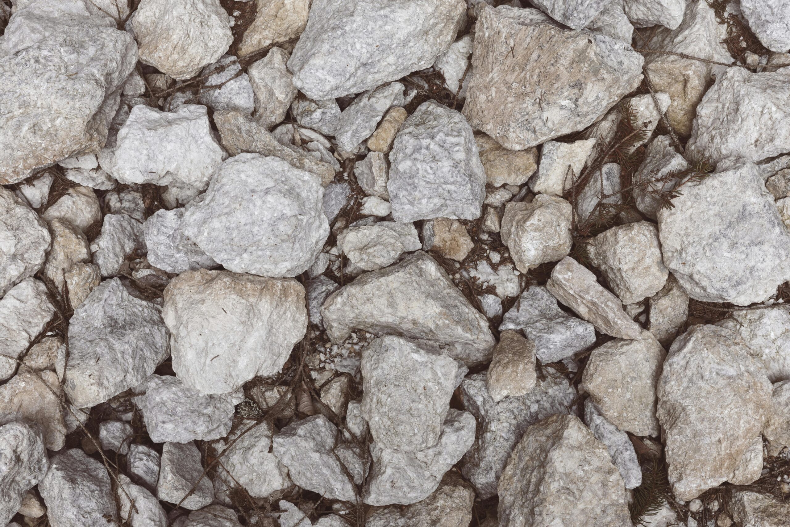 Detailed close-up of natural gray stones forming a textured surface, ideal for backgrounds.
