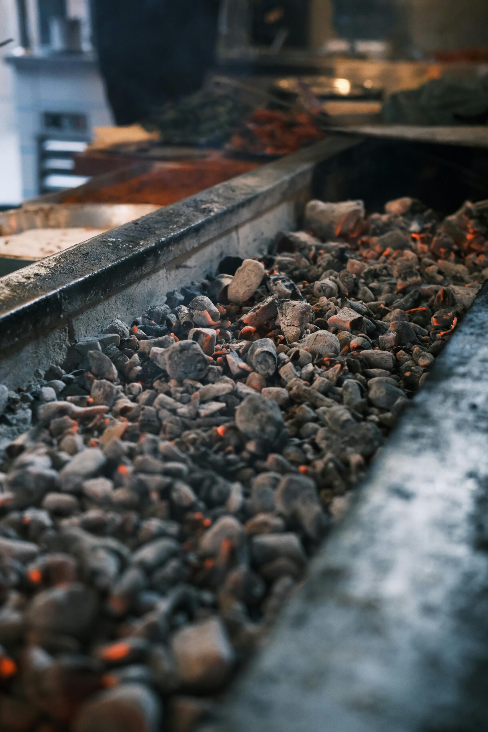 Close-up of glowing coals on a barbecue grill in Diyarbakır market, perfect for grilling enthusiasts.